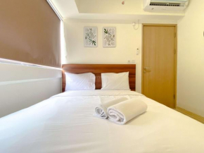 Homey 2BR with Work Space at Meikarta Apartment By Travelio
